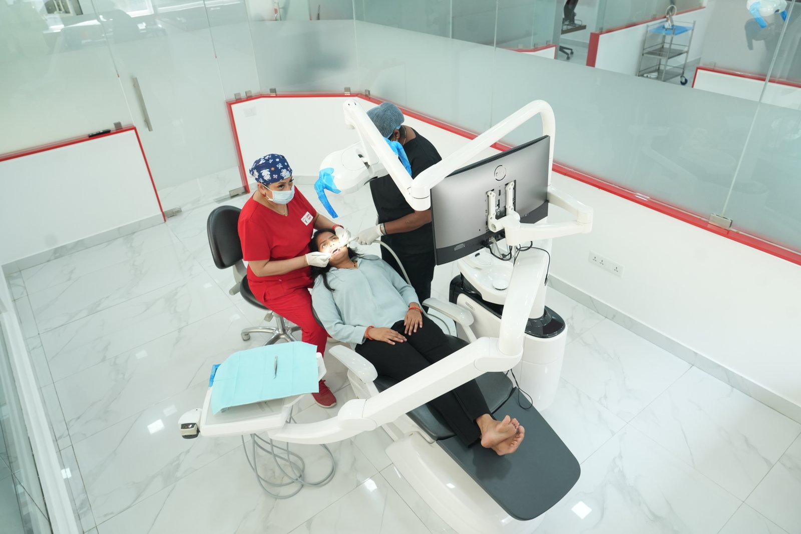 Dentist treating a smiling patient at Lifetime Dental